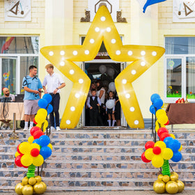 Conderyang party entrance arch at night for red carpet.