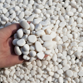 Garden bed edge accent with CONSDAN river rocks for subtle refinement