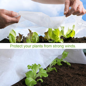 Cookmaster floating row cover placed over garden plants for breathable protection.