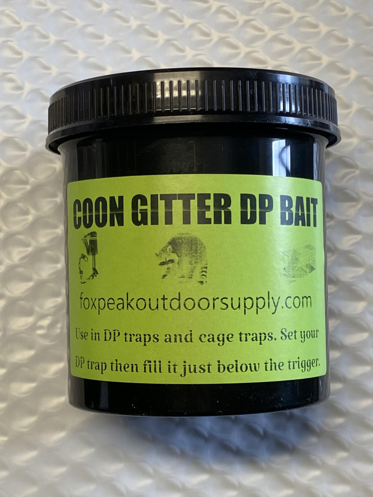 Coon Gitter Bait used in a live trap for raccoon capture.