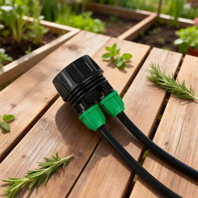 Garden setup using Copadri adapter links faucet to tubing for efficient watering.