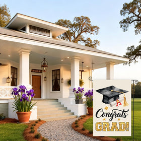 CoquetteBow012 2026 graduation flag displayed in a lawn or porch.