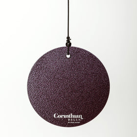 Corinthian Bells 36 plum wind chime on a patio adds ambient outdoor decor