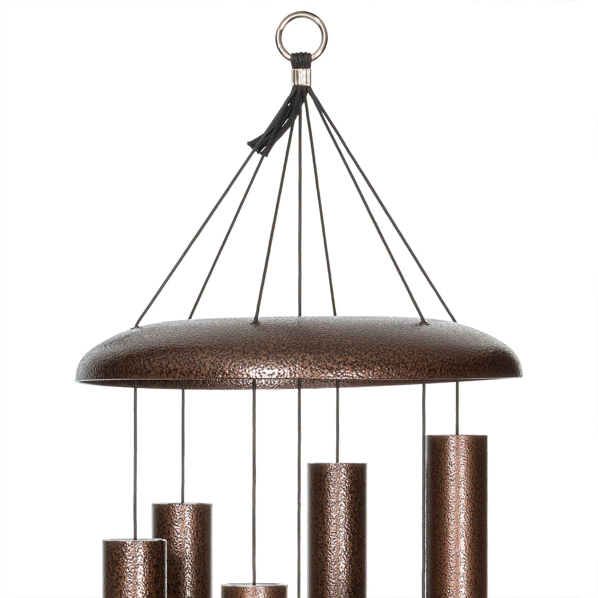 Corinthian Bells copper vein chime in garden setting emphasizes elegant outdoor decor with bold presence.