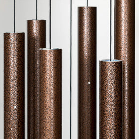 Corinthian Bells wind chime tubes closeup highlights tuned tubes for resonant, soothing tones.