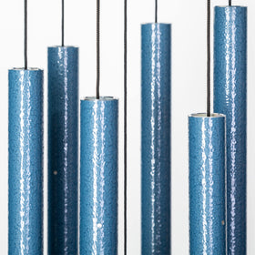 Corinthian Bells Sky Blue wind chime in backyard for relaxing tones.