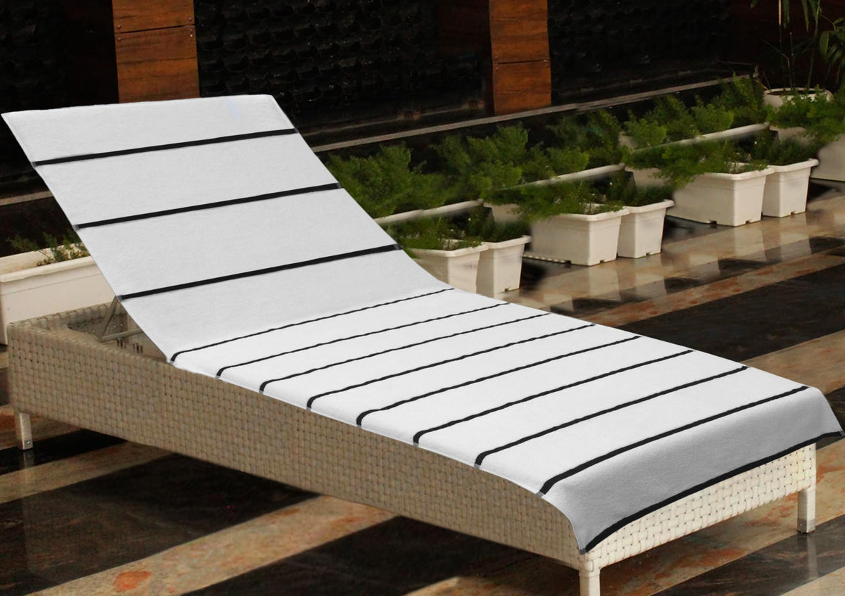 COTTON CRAFT striped cover by poolside in bright sun.