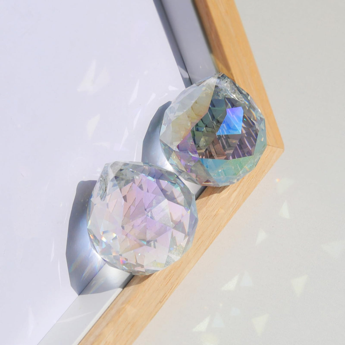 cozyou hanging crystal prisms ready to adorn windows and walls.