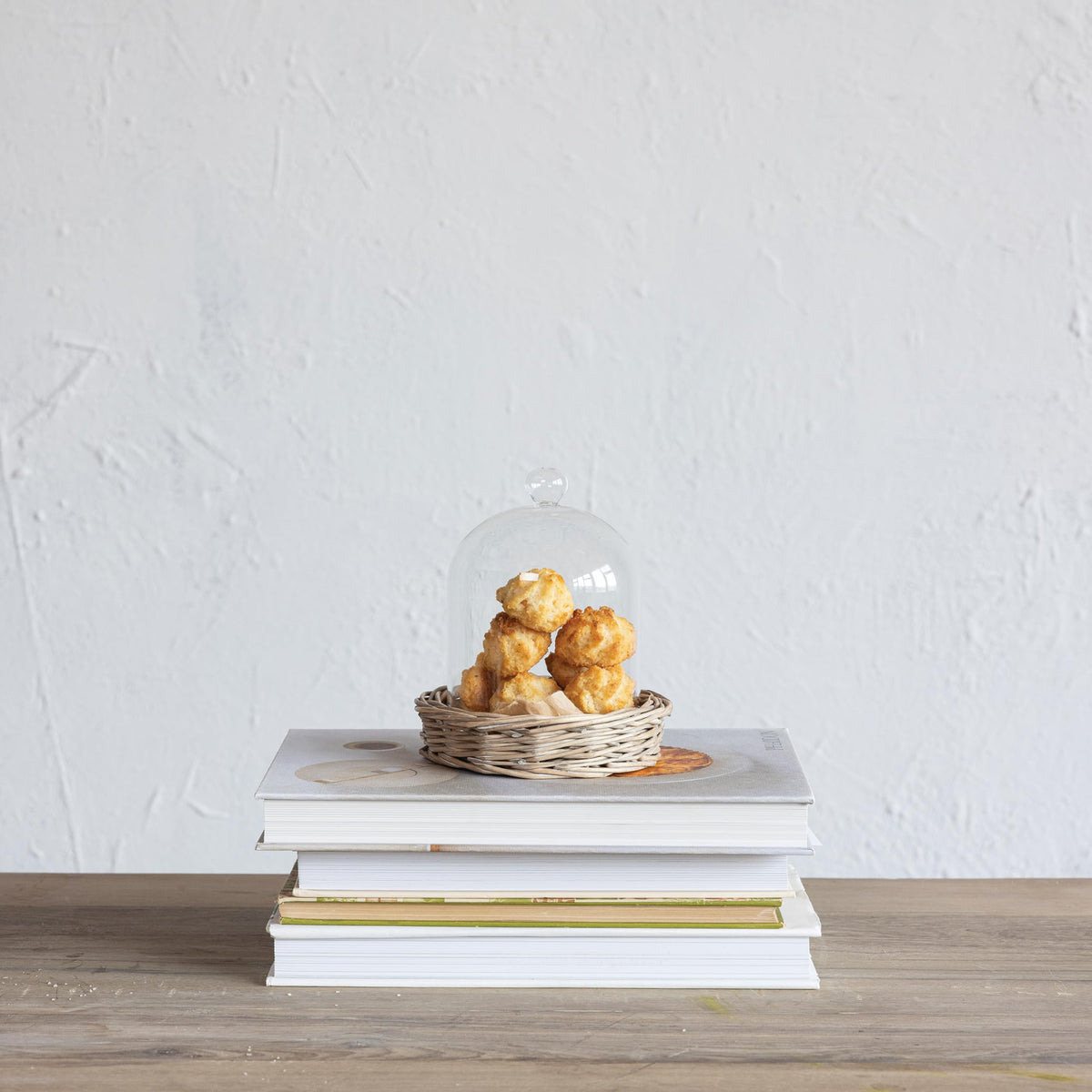 Creative Co-Op cloche with willow base ideal for centerpieces and table accents.