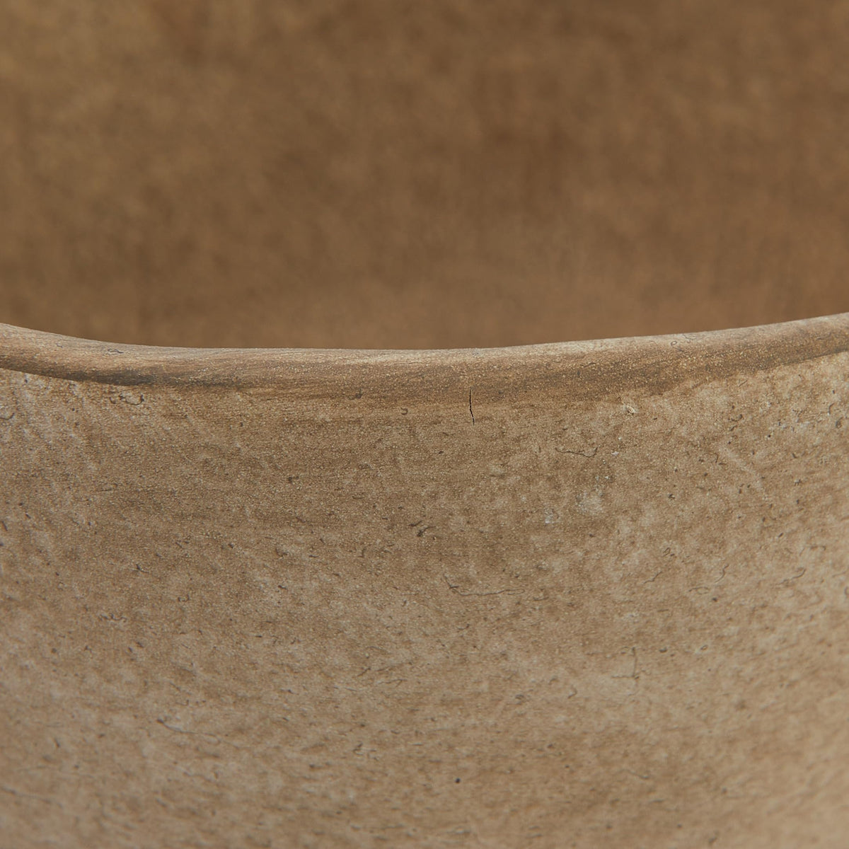 Creative Co-Op five-point-five-inch diameter footed planter suits small-space arrangements.