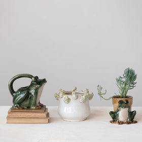 Creative Co-Op stoneware planter close-up shows frog detailing and finish