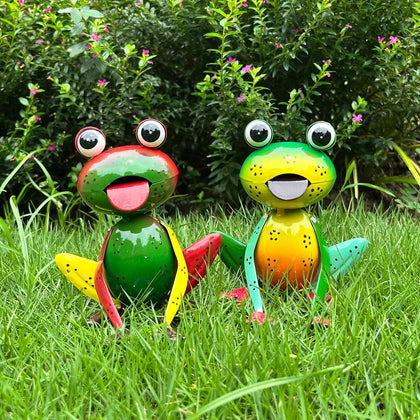Cruis Cuka metal frogs brighten the outdoor garden with cheerful yellow-green eyes.