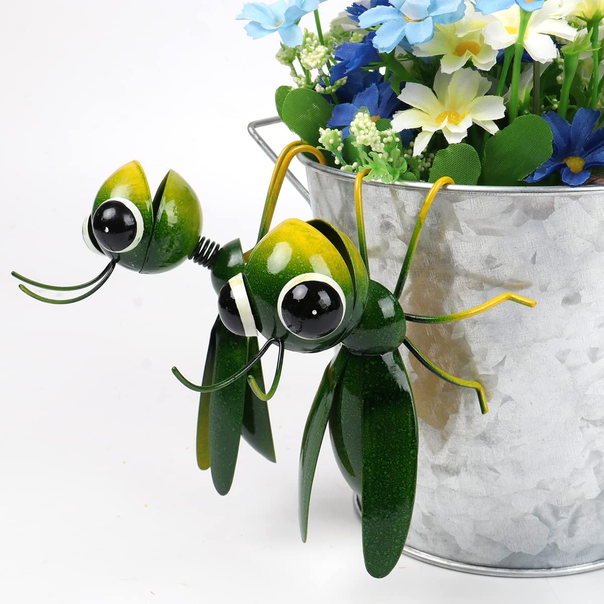 Outdoor lawn decor grasshopper to brighten patios and yards.