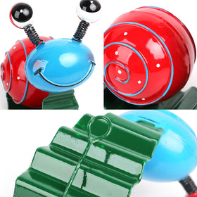 Wall mounted Cruis Cuka snail decor on fence shows flexible placement
