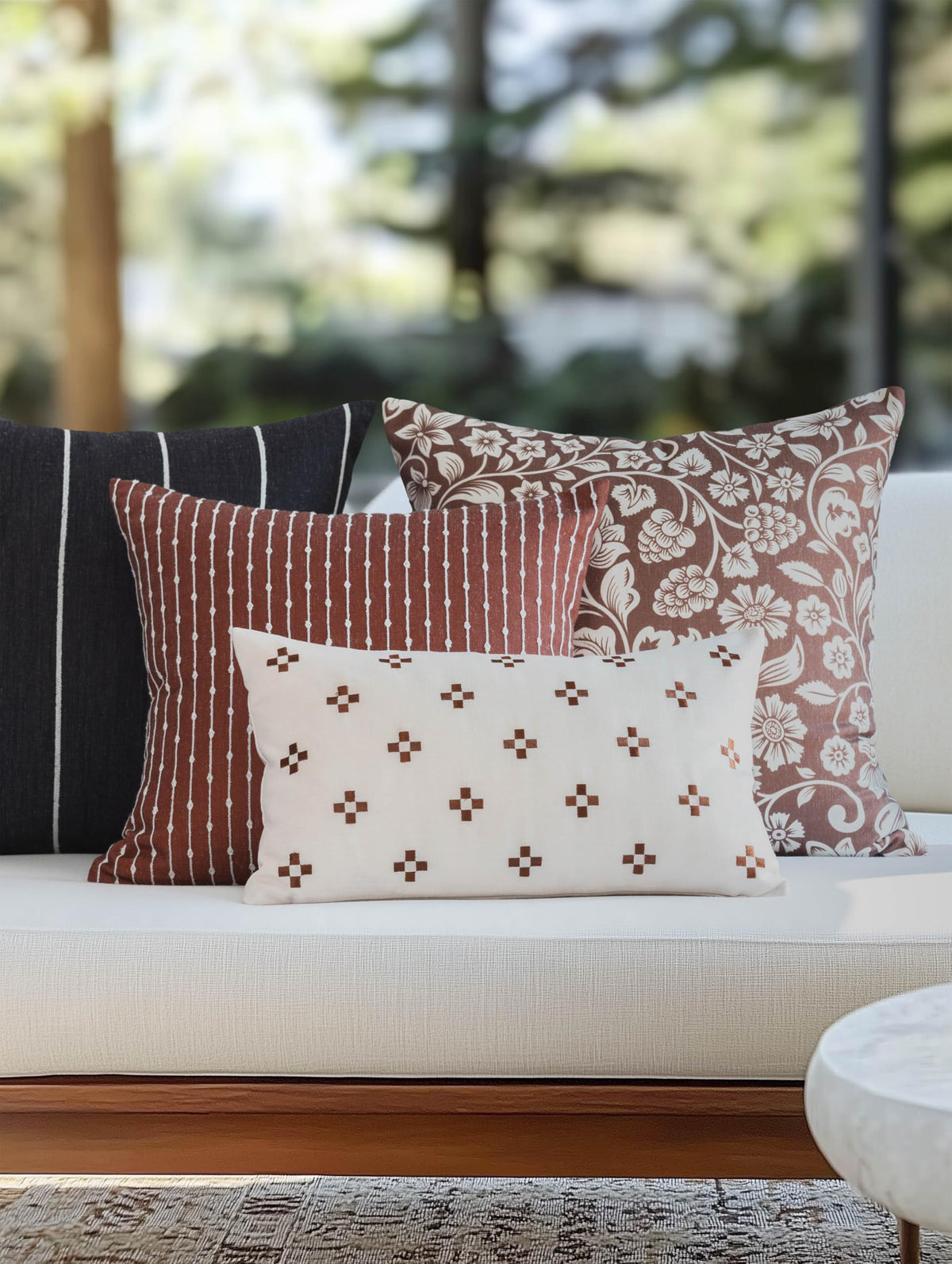 Crumbs Home embroidered small squares on cover add subtle texture to seating spaces.