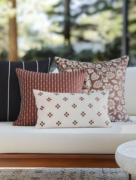 Crumbs Home embroidered small squares on cover add subtle texture to seating spaces.