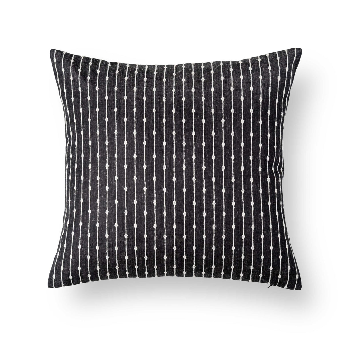 Crumbs Home indoor couch setting featuring the fall linen pillow cover.