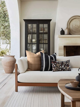 Crumbs Home pillow cover shows a reversible solid black reverse for versatile styling.