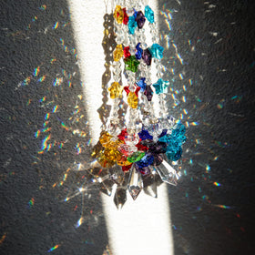 Crystalsuncatcher 8-inch glass angel pendant adds shimmering focal point.