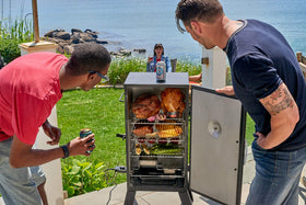 Cuisinart 30in electric smoker loading wood chips for rich smoke flavor