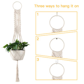 Cuttte Macrame Plant Hanger indoor display with four legs and cream finish.