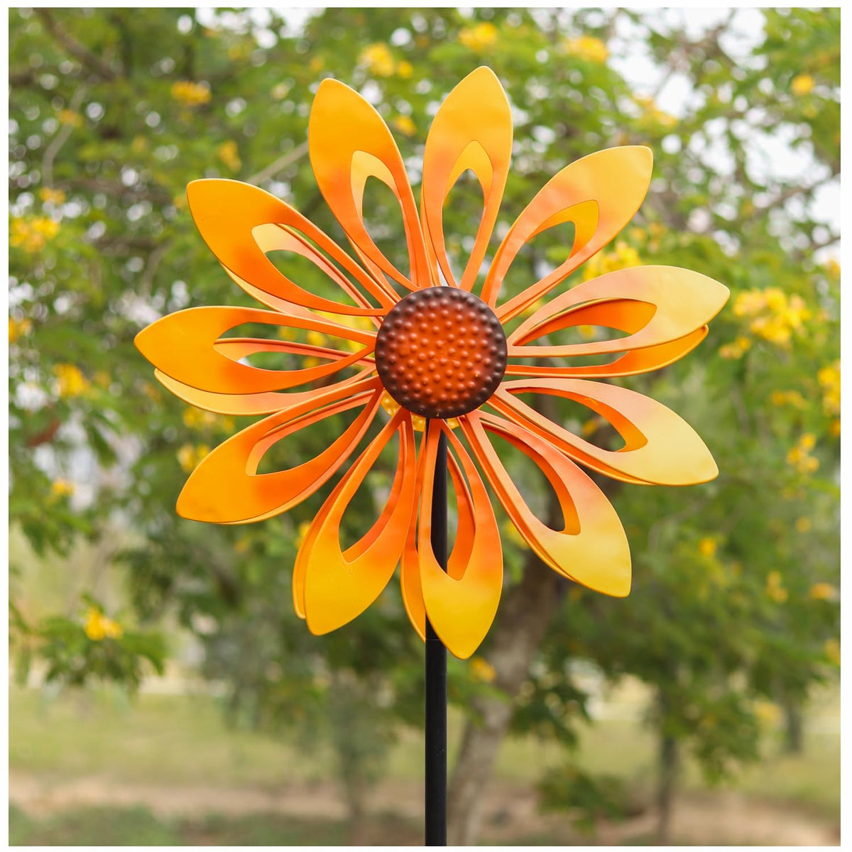 Cyan Oasis sunflower wind spinner front view in a bright garden
