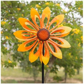 Cyan Oasis sunflower wind spinner front view in a bright garden