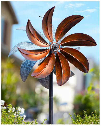Cyan Oasis wind spinner front view with copper-teal blades spinning in breeze
