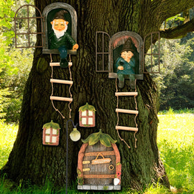 Czlotyh elf out the door tree hugger statue adds whimsy to outdoor decor.