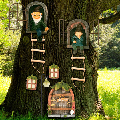 Czlotyh elf out the door tree hugger statue adds whimsy to outdoor decor.