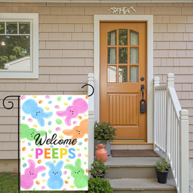 Dacawin Welcome Peeps Easter flag in a garden setting for outdoor decor