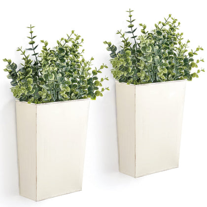 Dahey two-pack metal wall planters with antique finish add vintage charm to walls.