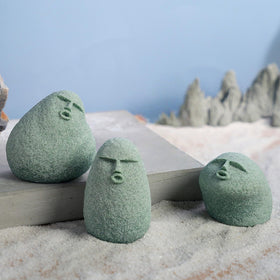 Daisylily stone man pond aquarium ornament enhances aquatic vignette.