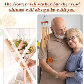 Damaigiift wind chime hanging in garden adding warm ambience