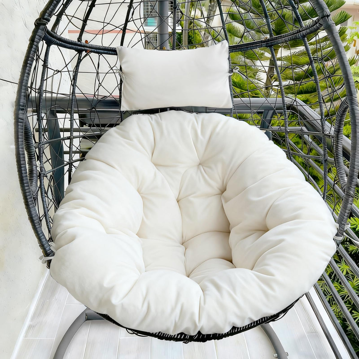 DANGHOOGY cream outdoor egg chair cushion offers plush full coverage for outdoor seating.