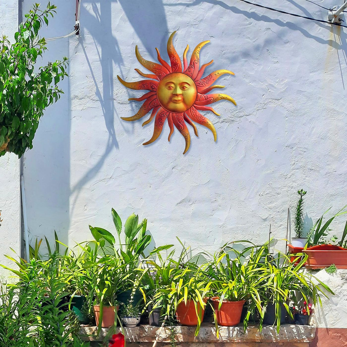 Daogtc sun face wall decor outdoors, adds warmth to gardens and patios.
