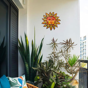 Daogtc sun wall hanging on a door adds sunlit charm.