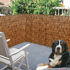 DearHouse reed fence installation with cedar posts demonstrates simple DIY setup.