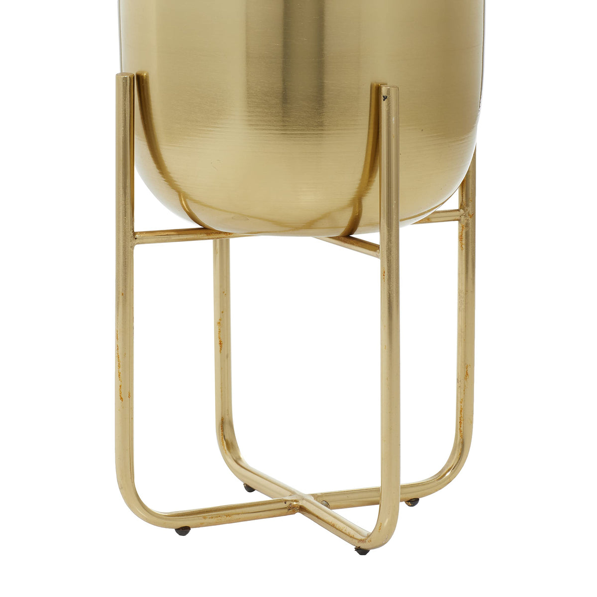 Close-up of Deco 79 brushed gold finish on the planters.