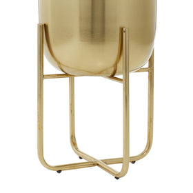 Close-up of Deco 79 brushed gold finish on the planters.