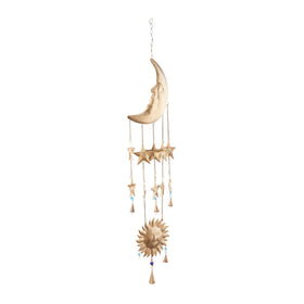 Deco 79 windchime with cone bells and beads enhances tranquil window corner.