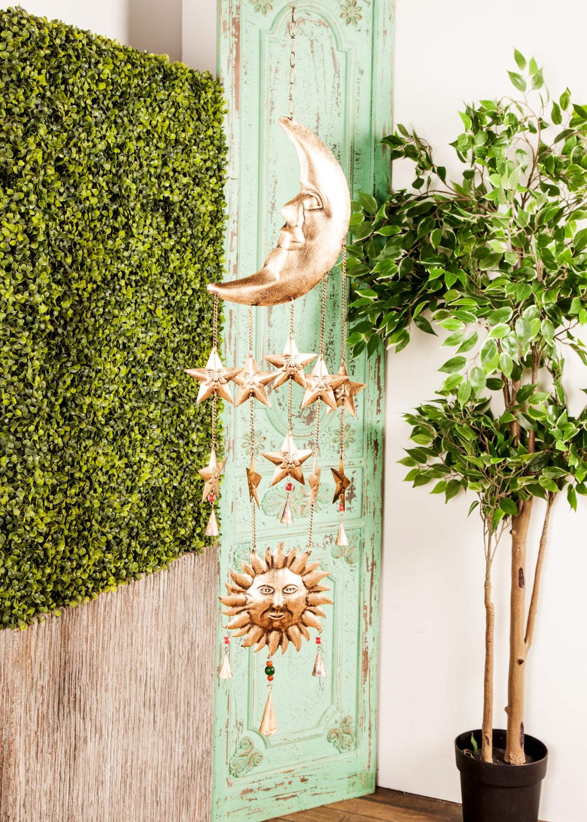 Deco 79 sun and moon decor for cozy indoor ambiance.