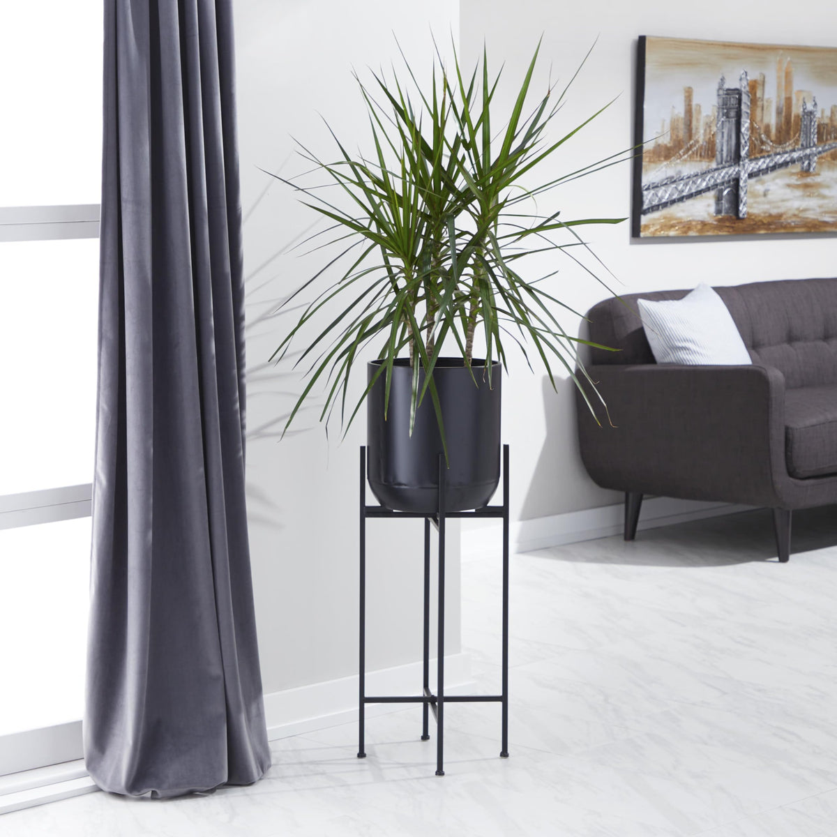 Deco 79 tall 36-inch black planter ideal for entryways.