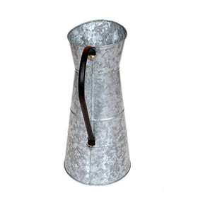 Deco 79 watering jug gray used as vase for florals.