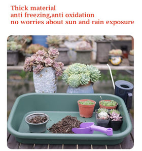 Defemim Garden Tidy Tray soil-mixing scene emphasizes a clutter-free workspace.