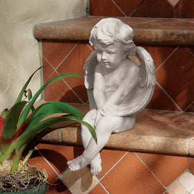 Design Toscano Antique stone finish detail complements classic decor.