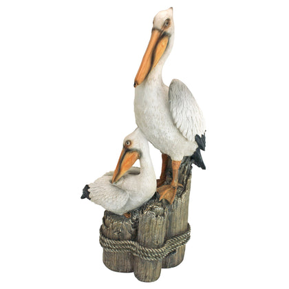 Design Toscano coastal pelican perch statue adds seaside charm to your garden.