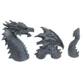 Design Toscano dragon tail coil provides dynamic garden movement.