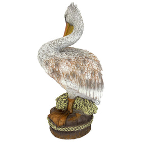 Design Toscano pelican statue, feathers detail—bright color and lifelike presence for outdoor spaces.