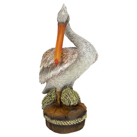 Design Toscano pelican statue, side view highlighting textured feathers for coastal-themed indoor display.